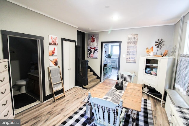 interior space featuring connected bathroom and light hardwood / wood-style flooring