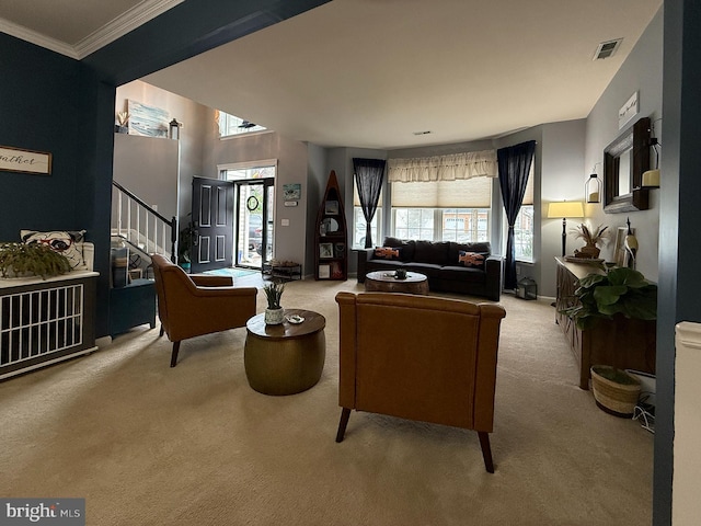 living room featuring ornamental molding and carpet flooring