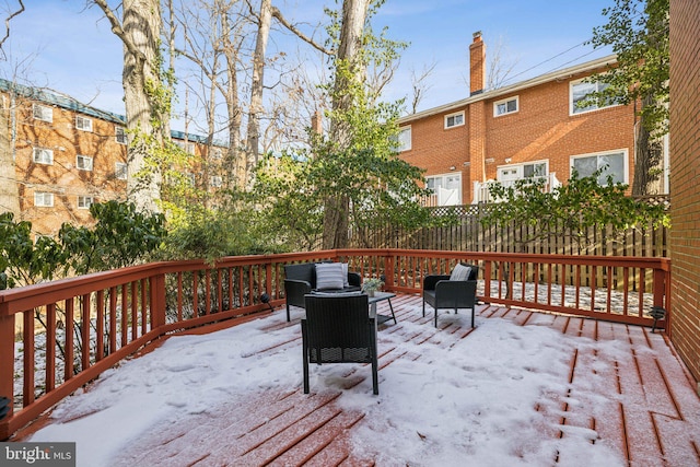 view of snow covered deck