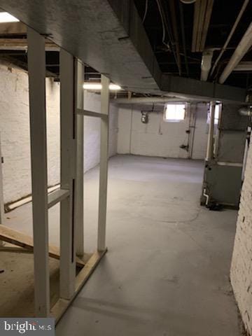 basement featuring heating unit