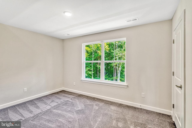 unfurnished room featuring carpet floors