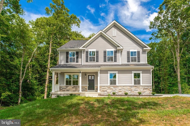 view of front of home featuring a front lawn and covered porch