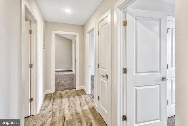 corridor featuring light hardwood / wood-style flooring