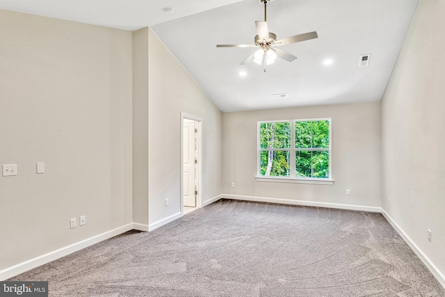 empty room with ceiling fan, carpet, and vaulted ceiling