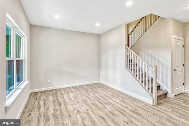 unfurnished room with light wood-type flooring