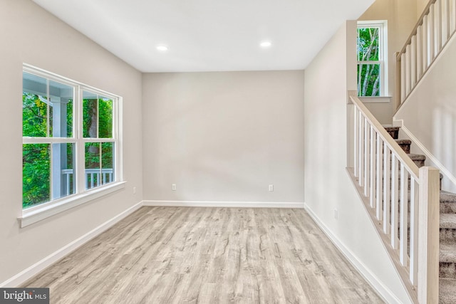 unfurnished room featuring light wood-type flooring