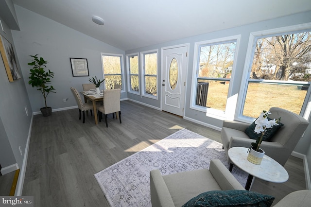 sunroom / solarium with vaulted ceiling