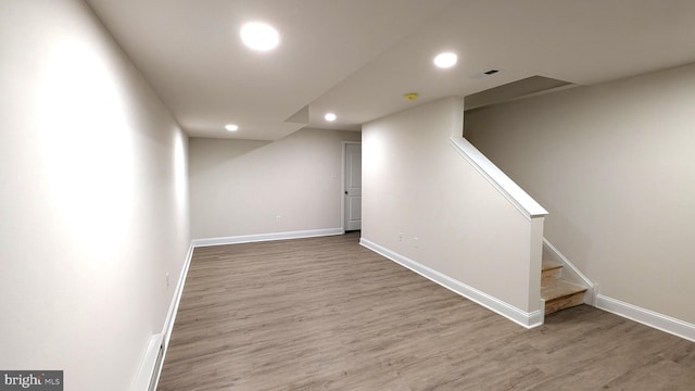 basement with wood-type flooring