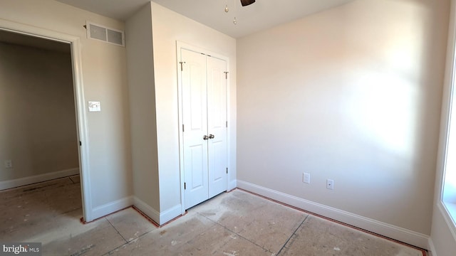 unfurnished bedroom with a closet and ceiling fan