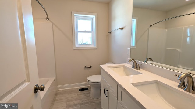 bathroom featuring hardwood / wood-style floors, vanity, and toilet