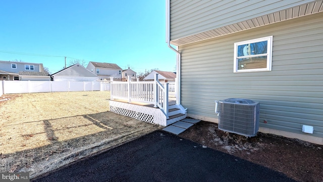 view of yard featuring a deck and cooling unit