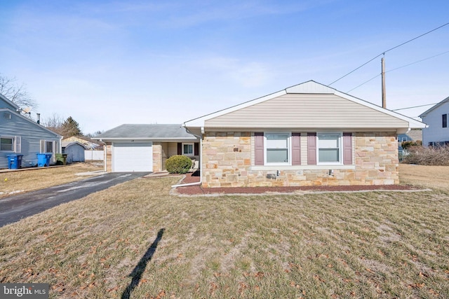 ranch-style home featuring a garage and a front lawn