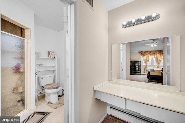 bathroom with a shower with door, ceiling fan, a baseboard radiator, tile patterned flooring, and toilet