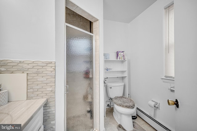 bathroom with tile patterned flooring, a baseboard radiator, a shower with shower door, and toilet