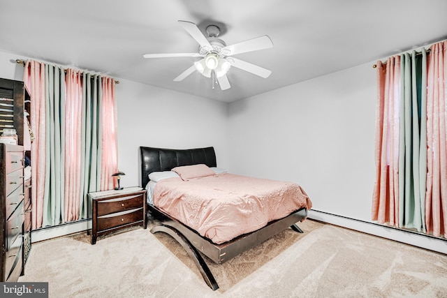 bedroom featuring ceiling fan, light carpet, and a baseboard heating unit