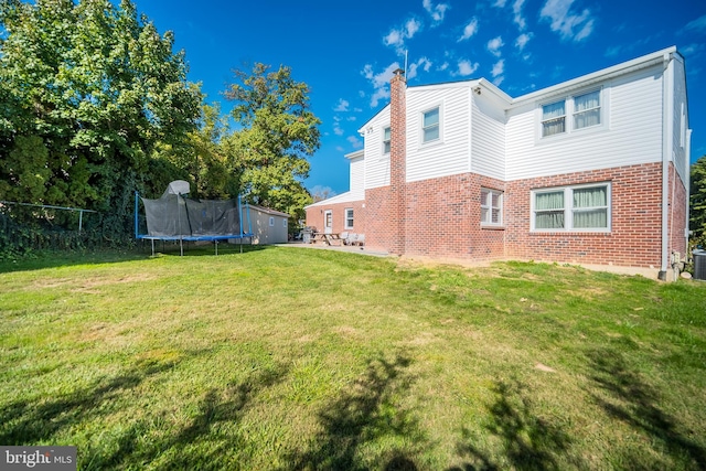 view of yard with a trampoline