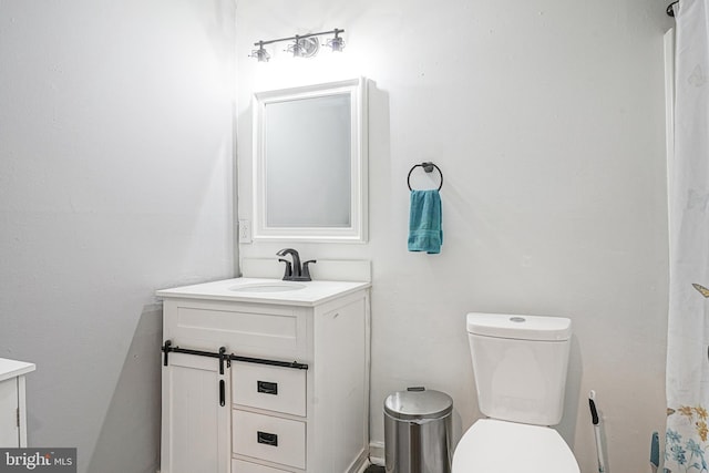 bathroom featuring vanity and toilet