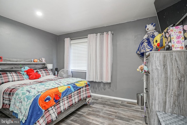 bedroom featuring hardwood / wood-style flooring