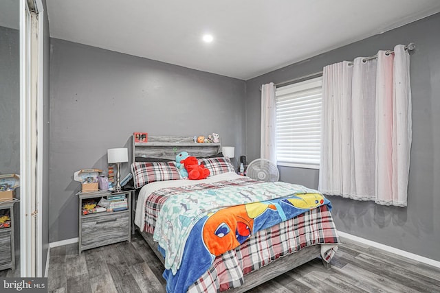 bedroom featuring dark wood-type flooring