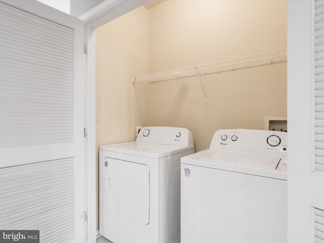 laundry room with separate washer and dryer