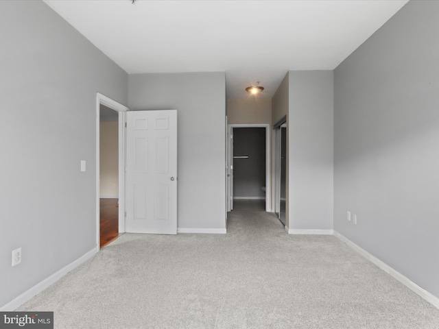 unfurnished bedroom with light carpet