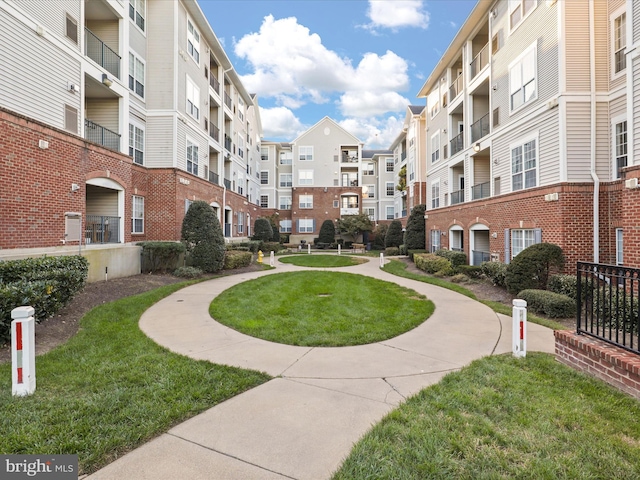 view of home's community featuring a lawn