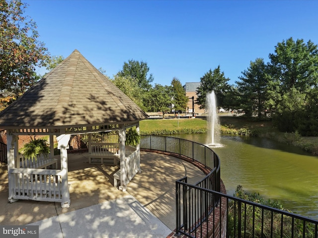 surrounding community featuring a water view and a gazebo