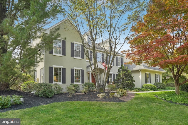 view of front of property with a front lawn