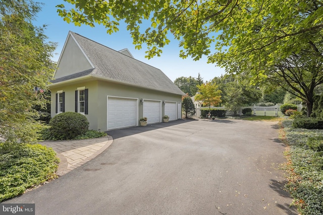 view of property exterior featuring a garage