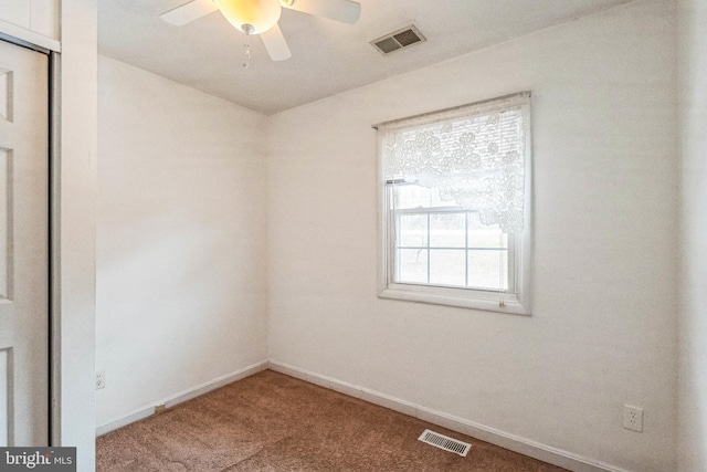 carpeted empty room with ceiling fan