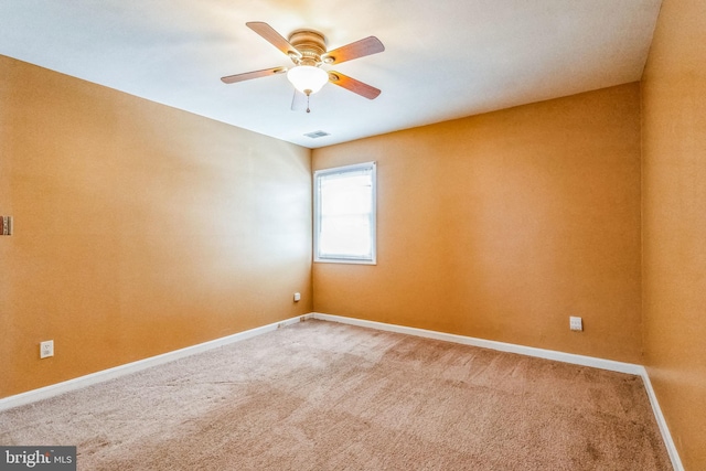 carpeted empty room with ceiling fan