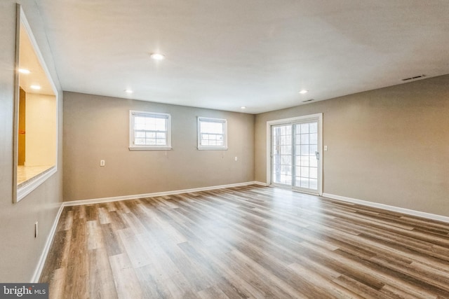 unfurnished room featuring wood-type flooring