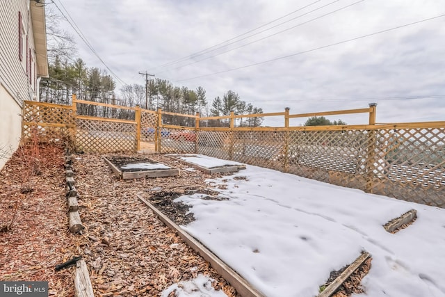 view of yard covered in snow