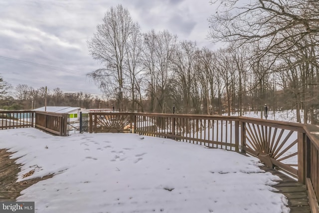 view of snow covered deck