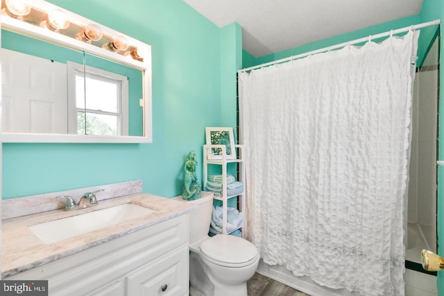 full bathroom featuring vanity, toilet, shower / bath combination with curtain, and hardwood / wood-style floors