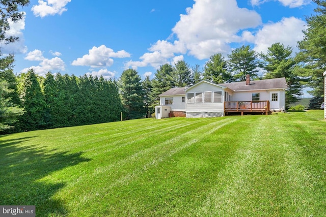 view of yard featuring a wooden deck