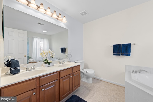 bathroom featuring toilet, vanity, and tiled bath