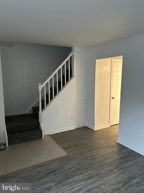 empty room with dark hardwood / wood-style floors