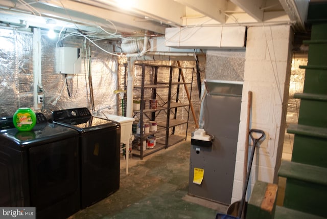 basement with washing machine and dryer and sink