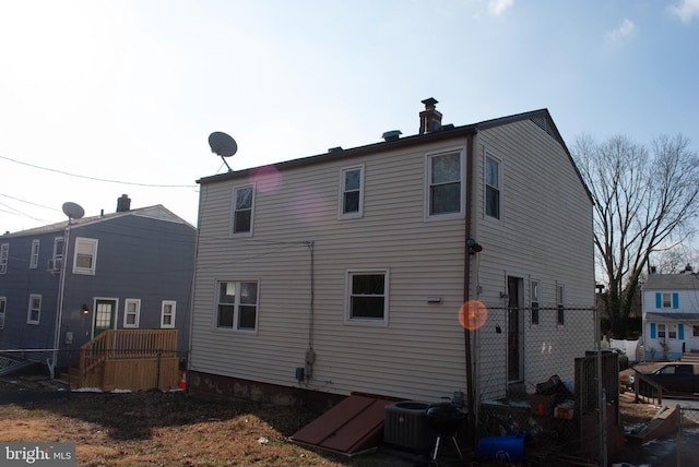 back of house featuring central AC