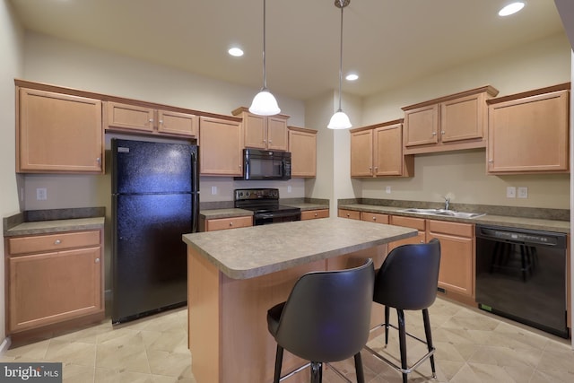 kitchen featuring pendant lighting, sink, a center island, black appliances, and light brown cabinets