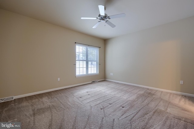 unfurnished room featuring carpet floors and ceiling fan