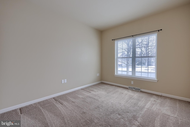 view of carpeted spare room