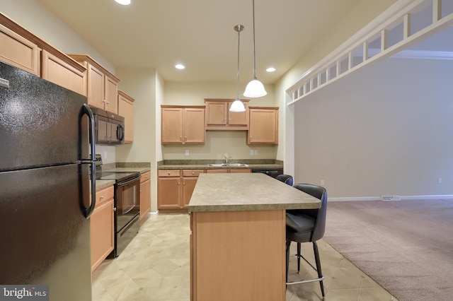 kitchen featuring a kitchen island, light brown cabinetry, hanging light fixtures, black appliances, and light carpet