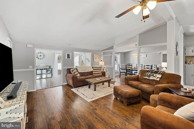 living room featuring vaulted ceiling, dark wood-type flooring, and ceiling fan