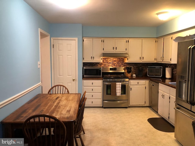 kitchen featuring backsplash and stainless steel appliances