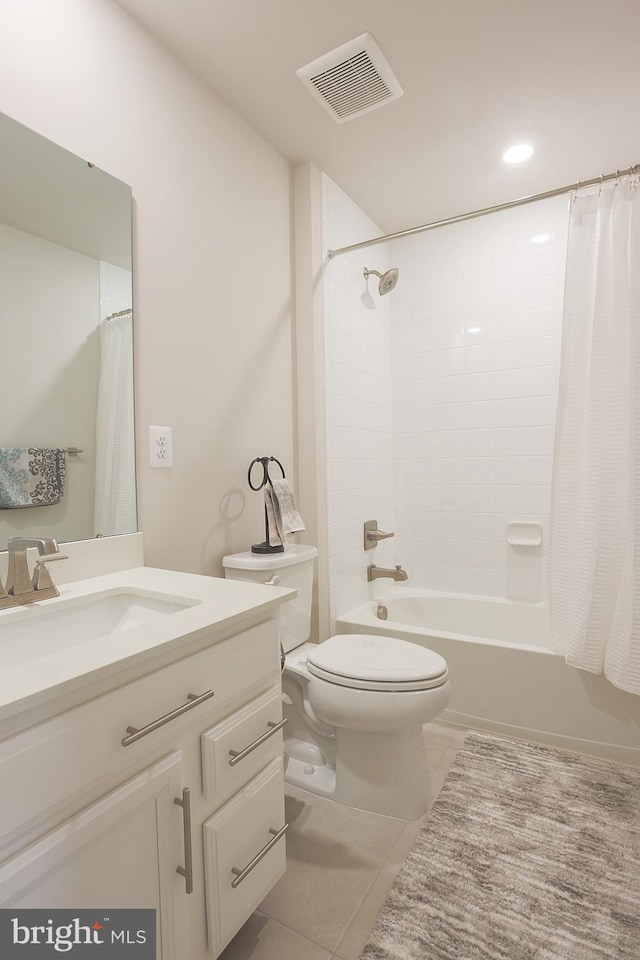 full bathroom with shower / tub combo with curtain, tile patterned floors, toilet, and vanity