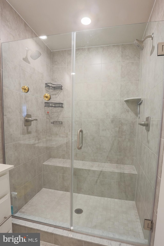 bathroom with vanity and an enclosed shower