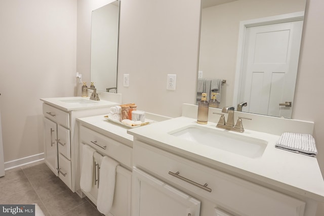 bathroom with tile patterned flooring and vanity