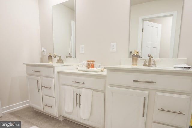 bathroom with vanity and tile patterned flooring